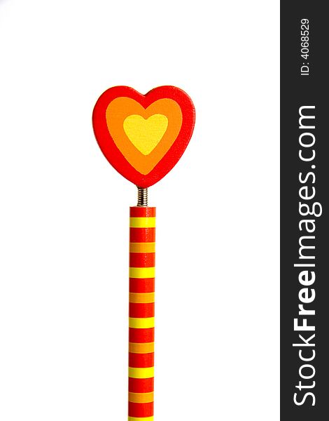 Colorful hearth in top of striped pencil