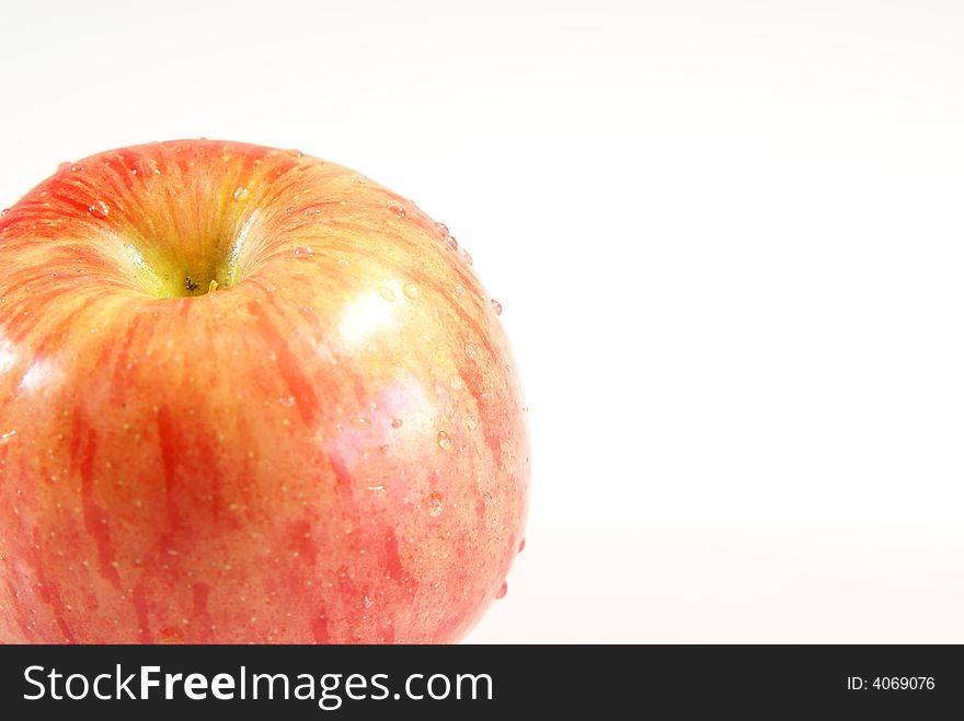 Fresh whole apple with water droplets