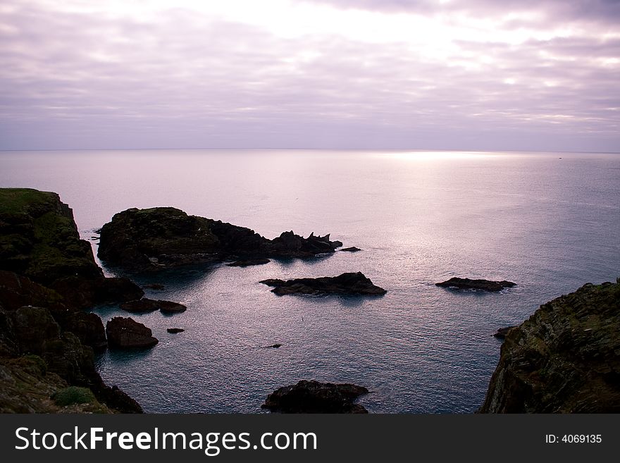 Calm and peaceful seascape with foreground rocks. Calm and peaceful seascape with foreground rocks