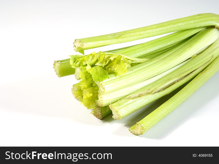 Celery bunch with leaves on white. Celery bunch with leaves on white