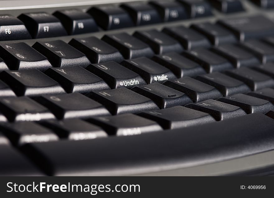 Close-up picture of a modern black ergonomic keyboard