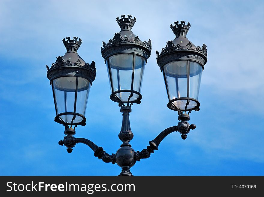 France, Paris: blue sky and Old bronze and glass lamp-post. France, Paris: blue sky and Old bronze and glass lamp-post