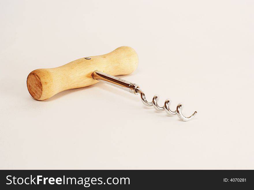 Corkscrew with wooden handle on white background. Corkscrew with wooden handle on white background