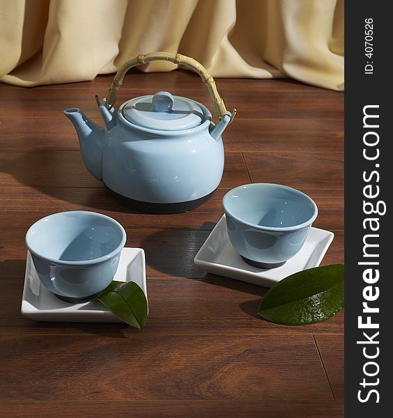 Tea set on parquet floor. Tea set on parquet floor