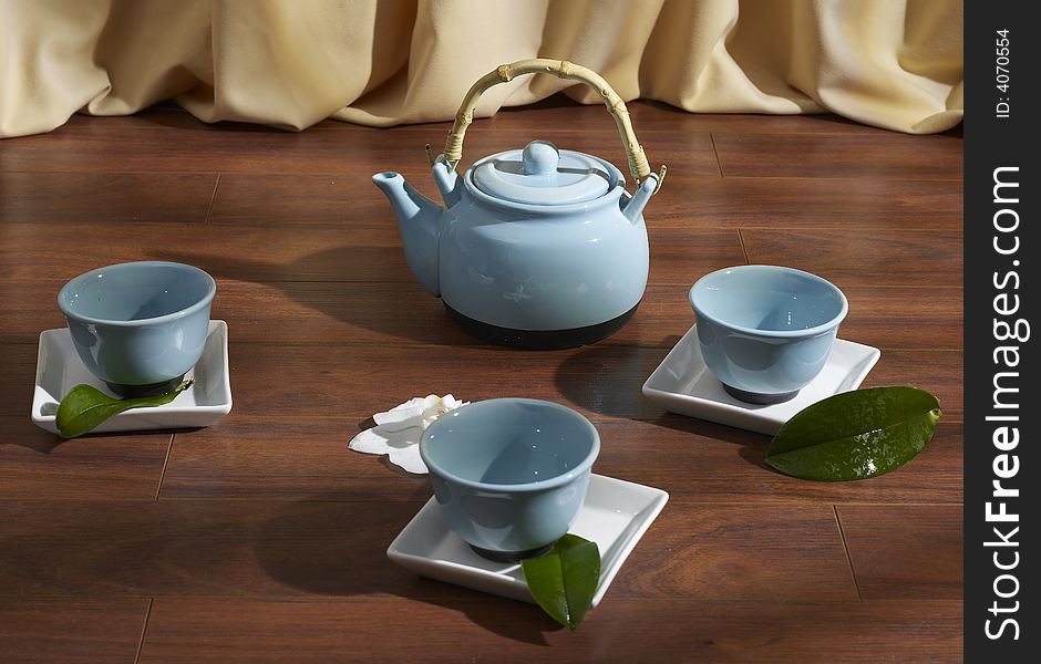 Tea set on parquet floor. Tea set on parquet floor