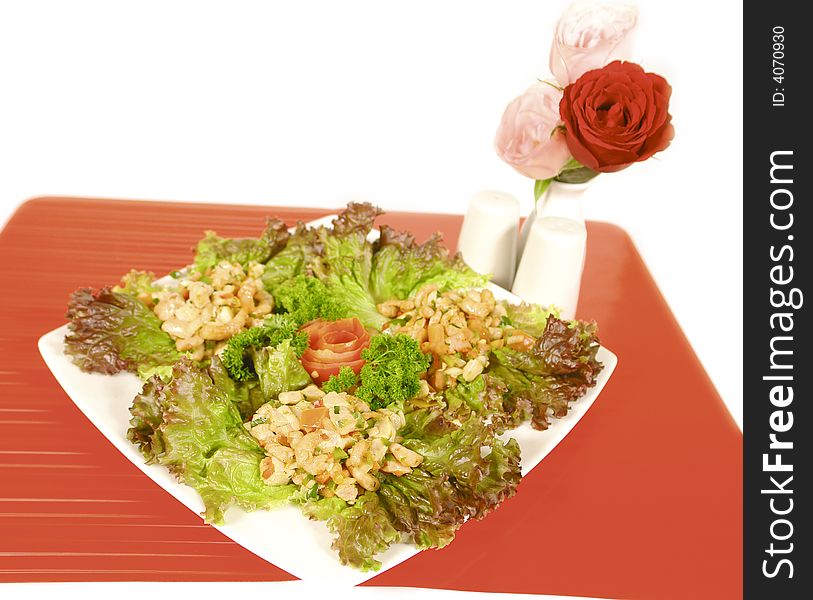 Little pink shrimps served on lettuce with roses