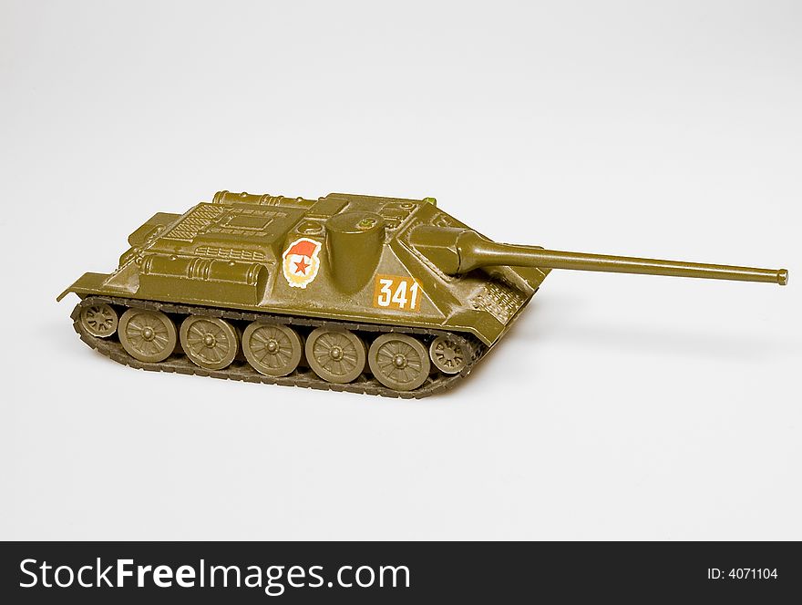 Old soviet tank toy with USSR sign on white background.