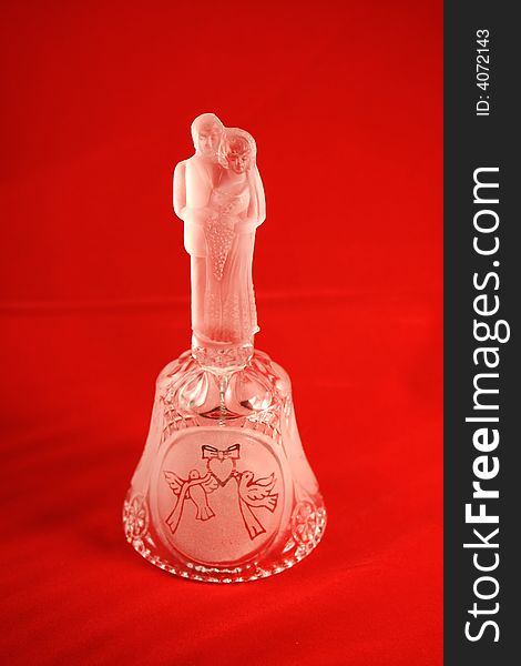 Crystal Bell with young couple as symbol of love
