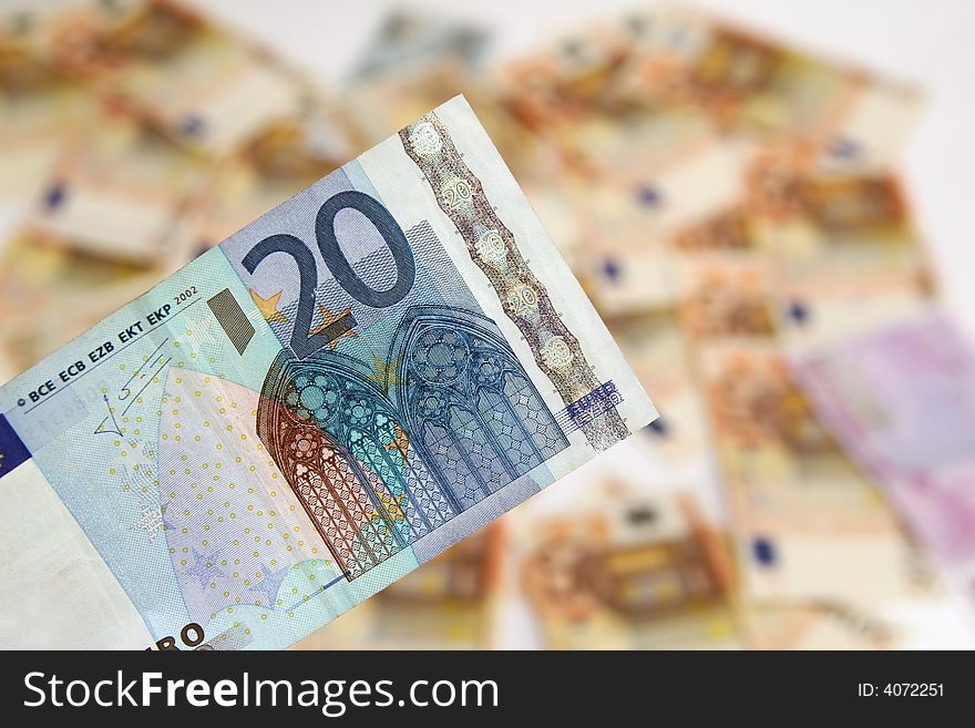 Twenty euro banknote on background of money