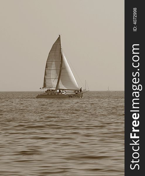 Sailer on the sea in black and white colors