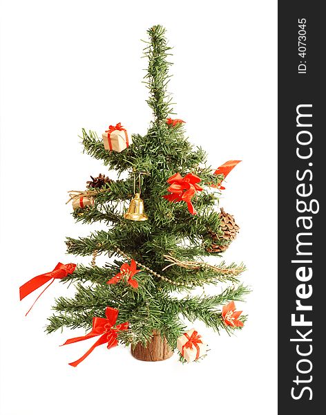 Little artificial christmas tree with bows, ribbons, bells. Little artificial christmas tree with bows, ribbons, bells