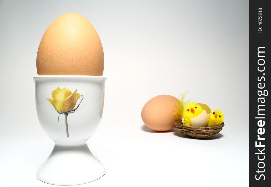 Easter still life with little chicken and two eggs