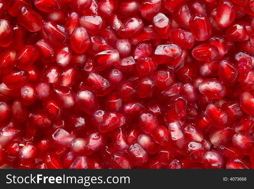 Red ripe pomegranate seeds natural background. Red ripe pomegranate seeds natural background