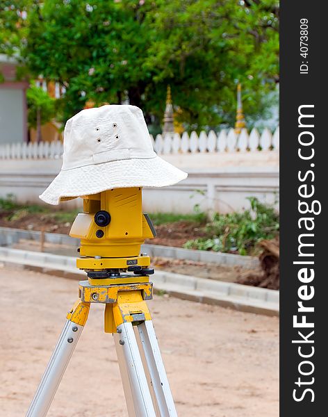 Surveyor equipment with a hat on top of it. Surveyor equipment with a hat on top of it