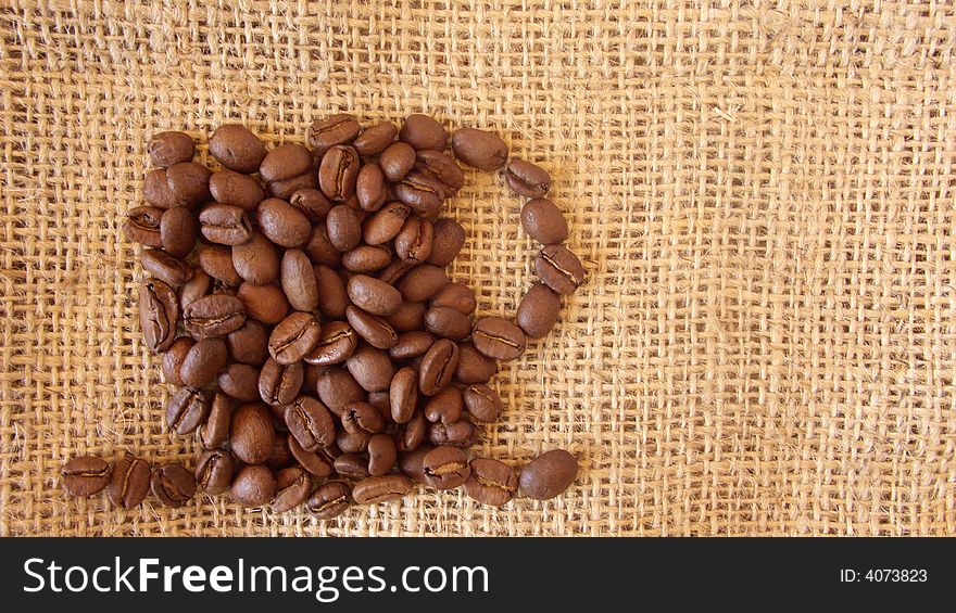 Cup of coffee designed out of coffee beans. Cup of coffee designed out of coffee beans