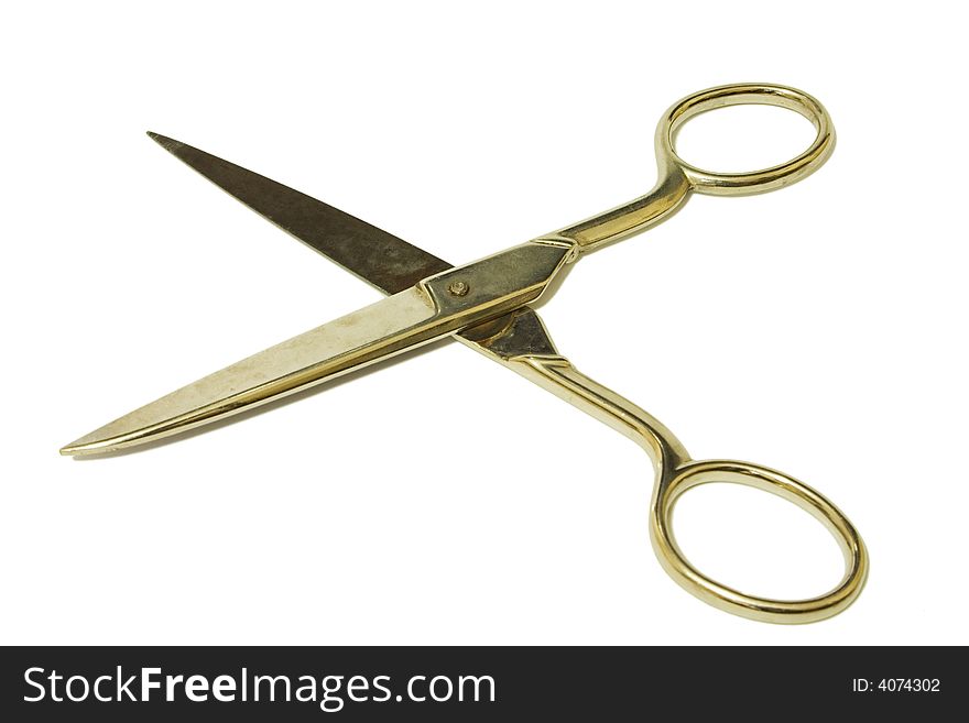 Open scissors in white background