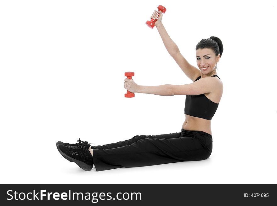 Beautiful girl with dumbbells on  isolated background