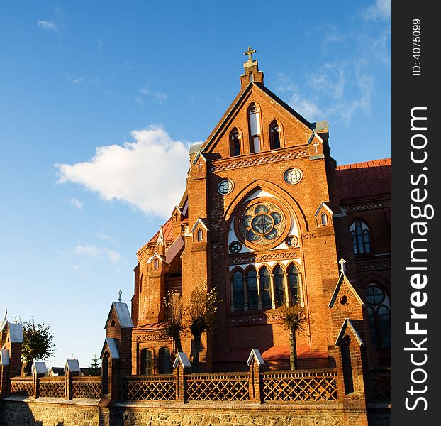 Sunlit old red brick church. Sunlit old red brick church