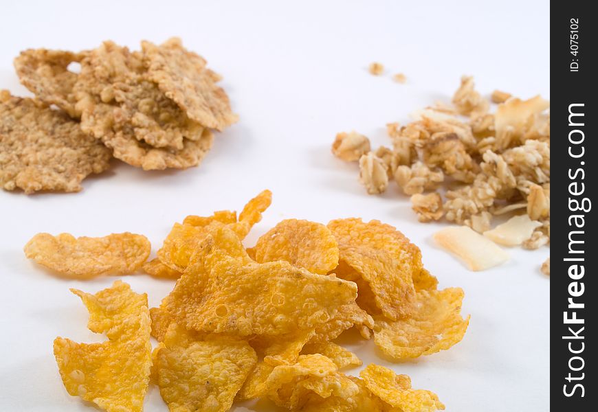 Separate files of wheat, corn flakes and muesli