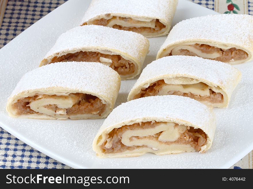 Apple roll- strudel on a plate. Apple roll- strudel on a plate