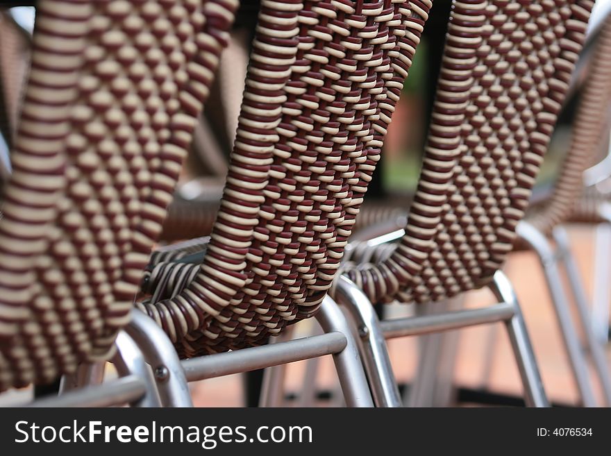 Row of three rattan chairs horizontal. Row of three rattan chairs horizontal