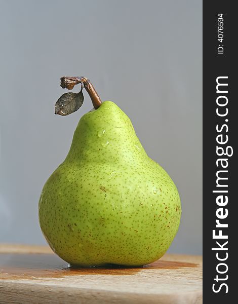 Pear with leaf still intact. Pear with leaf still intact