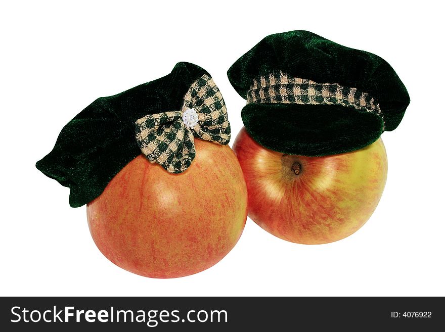 The juicy appetizing motley red apple has dressed a female and man's hats.  marital pair. The juicy appetizing motley red apple has dressed a female and man's hats.  marital pair