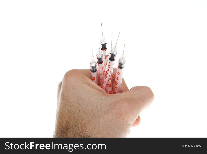 Hand with syringes on a white background