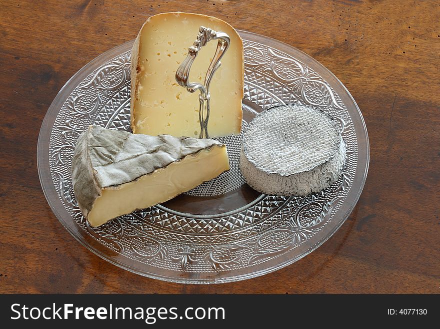 French cheeses board on an old table. French cheeses board on an old table