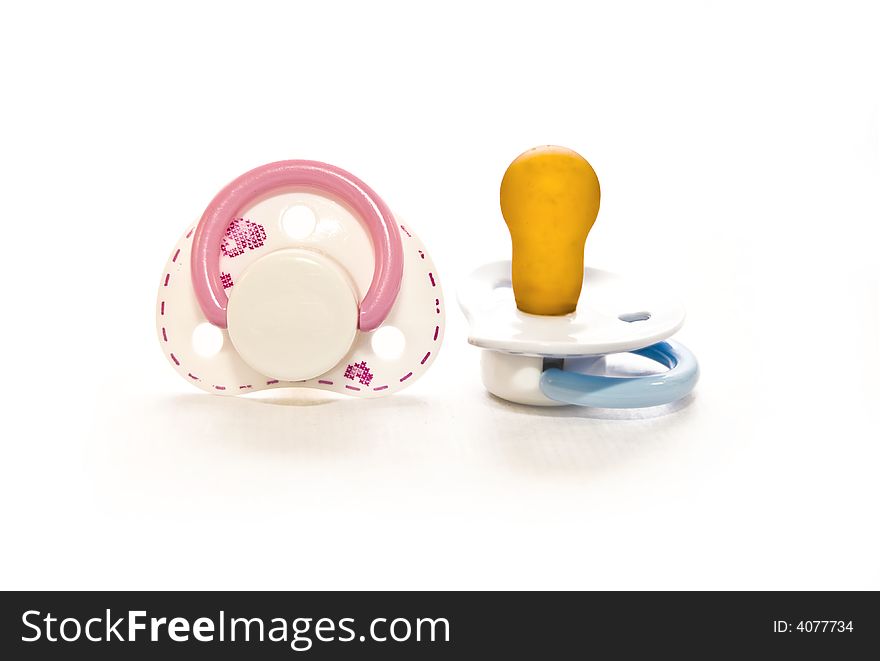 Couple Baby pacifier on white with soft shadow. Couple Baby pacifier on white with soft shadow