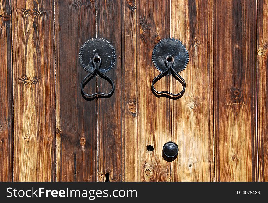 Door handles on a old wooden door