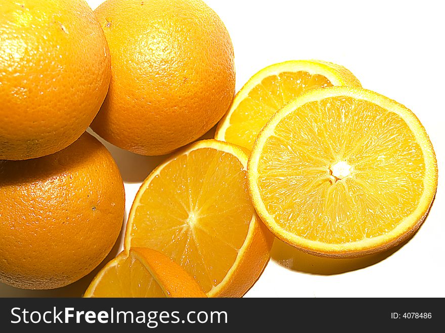 Citrus fruit oranges, whole and sliced, isolated on white