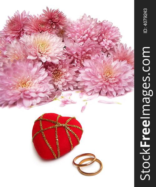 Wedding rings with red velvet heart and bouquet of chrysanthemum. Wedding rings with red velvet heart and bouquet of chrysanthemum