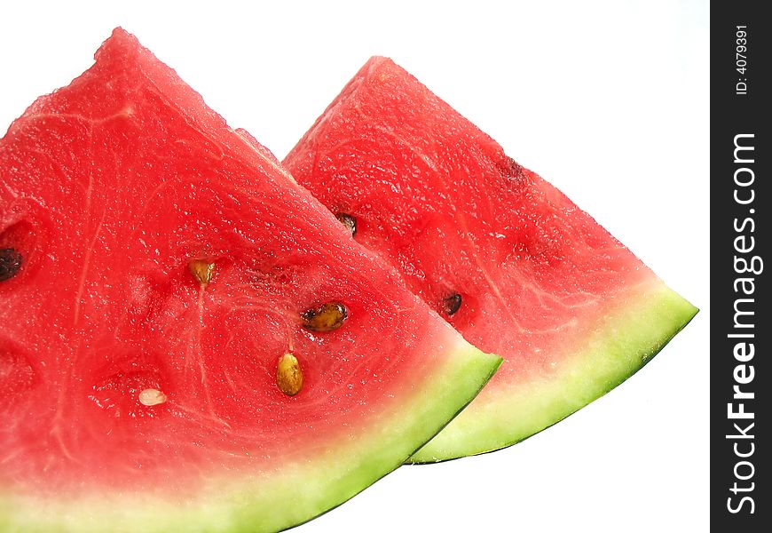 Slices of watermelon with seeds isolated on white