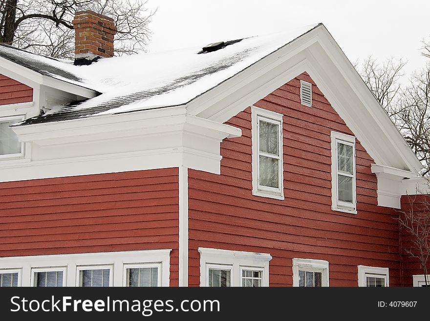 Old weather classic american Greek Revival house detail- a study in red and whote. Old weather classic american Greek Revival house detail- a study in red and whote