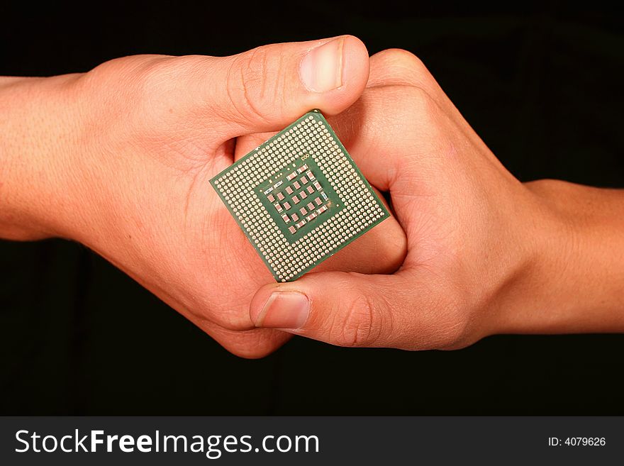 Two hands intertwined holding a Computer CPU (Processor)