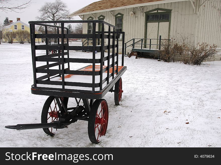 Classic 19th Century railroad station with Luggage cart carrier in winter scene. Classic 19th Century railroad station with Luggage cart carrier in winter scene