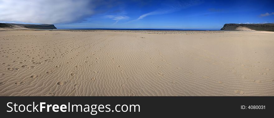 Wide panoramic photo of an idyllic beach. Wide panoramic photo of an idyllic beach.