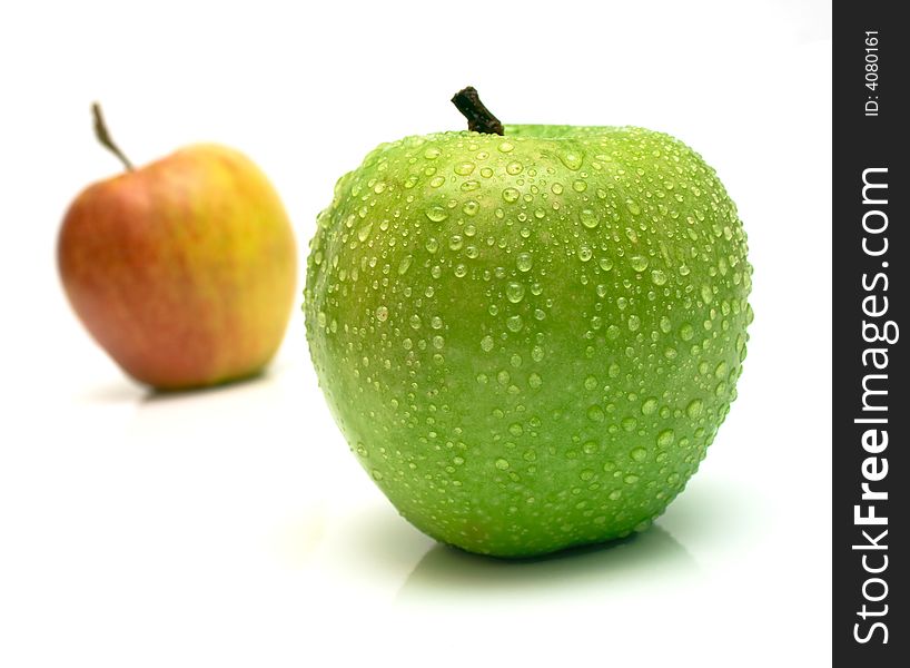 Red and green apple. Shallow DOF. Focus on a green apple. Red and green apple. Shallow DOF. Focus on a green apple.