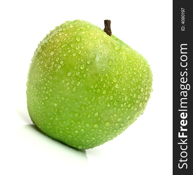 The ripe juicy apple covered by drops of water. Isolation on white, shallow DOF. The ripe juicy apple covered by drops of water. Isolation on white, shallow DOF.