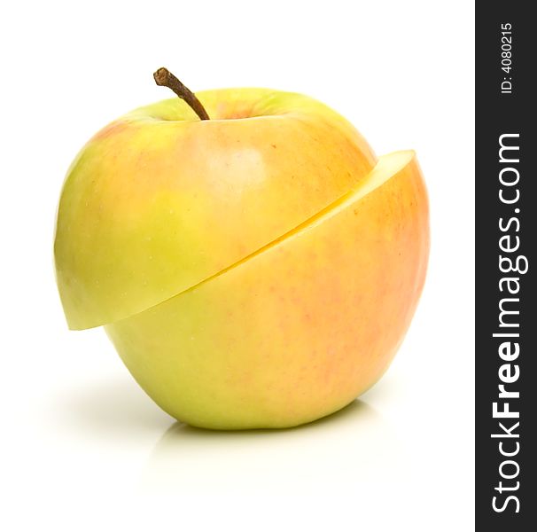 The ripe apple is obliquely cut half-and-half. Isolation on white. The ripe apple is obliquely cut half-and-half. Isolation on white.