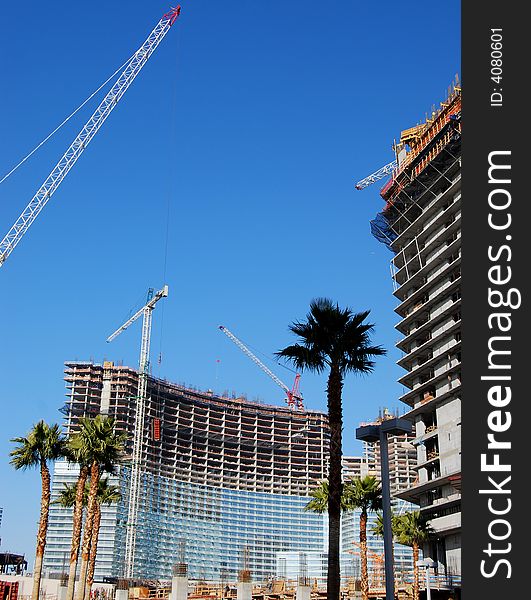 Over view of condominium / hotel construction site with palms. Over view of condominium / hotel construction site with palms