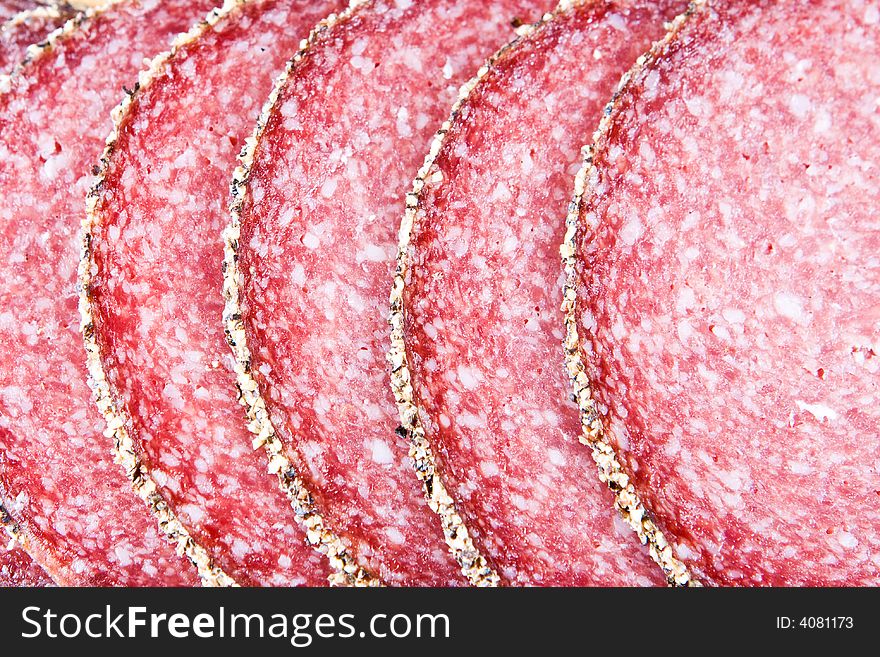 A close-up of peppered salami