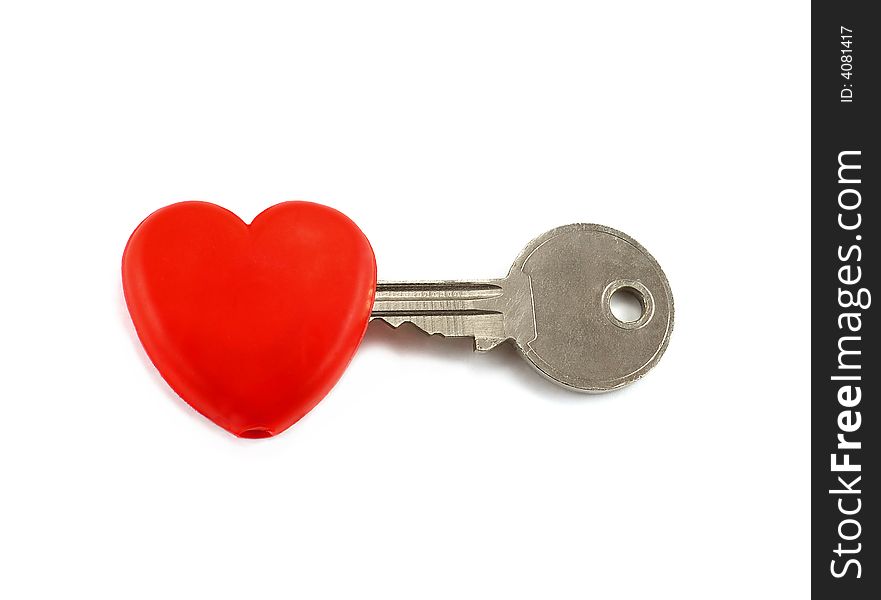 Silver key is inserted into red heart. Silver key is inserted into red heart