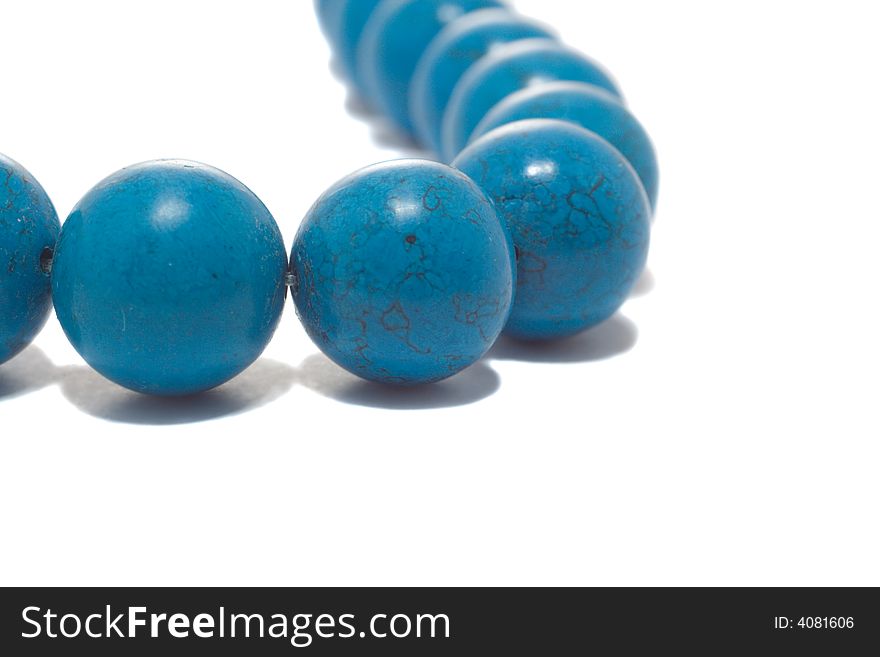 Close-up blue necklace, isolated on white. Close-up blue necklace, isolated on white