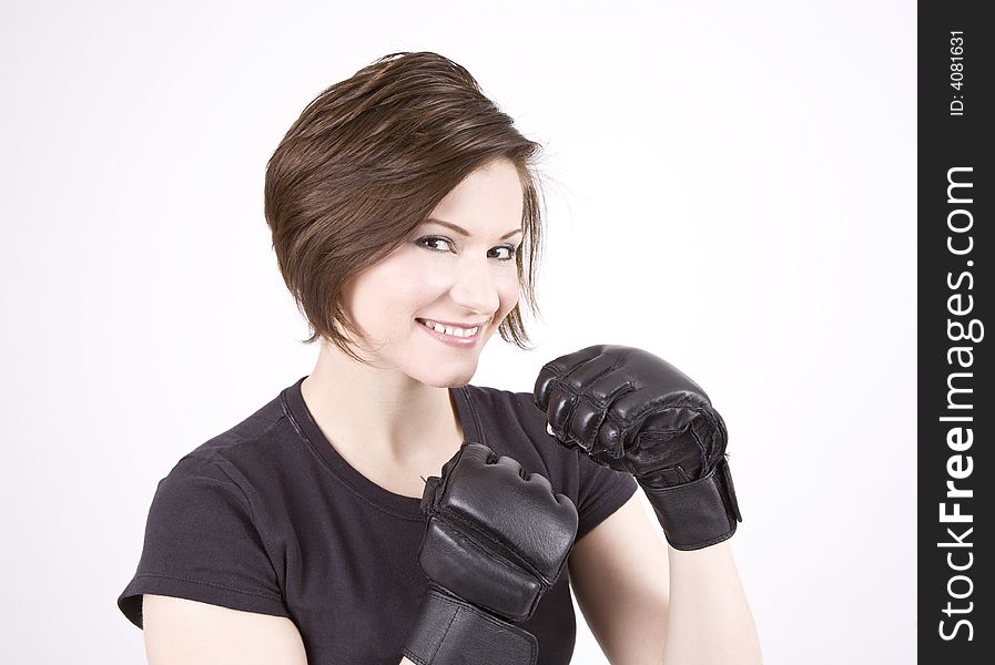 Brunette woman in boxing attire smiling at the camera. Brunette woman in boxing attire smiling at the camera.