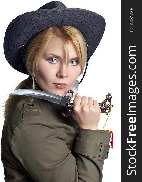 Scout girl wearing uniform, with sharp knife in her hand