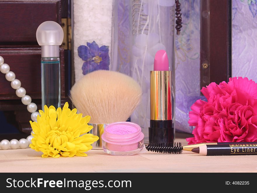 Jewelry and Cosmetics with Flowers on Vanity. Jewelry and Cosmetics with Flowers on Vanity