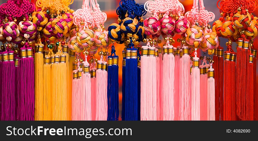 Chinese knotted balls with tassels sold as decorative ornaments. Chinese knotted balls with tassels sold as decorative ornaments