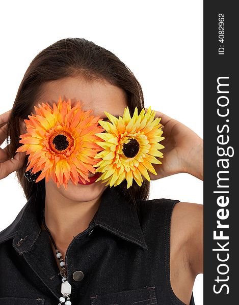 Playful girl covering her face with flowers